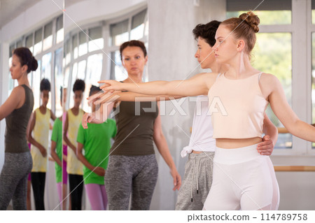 Teen girl and boy, ballet students, learning paired technique Teen girl and boy, ballet students, learning paired technique 114789758
