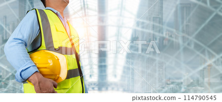 Civil engineer architect standing holding a safety helmet on construction site background, Construction site plans to build high-rise buildings, Engineer building concept, Background for construction. Civil engineer architect standing holding a safety helmet on construction site background, Construction site plans to build high-rise buildings, Engineer building concept, Background for construction. 114790545
