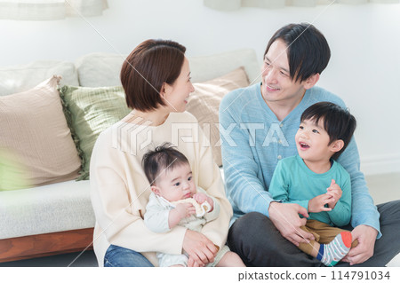 Smiling family of four people Smiling family of four people 114791034