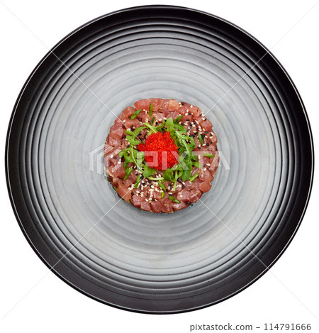Tuna and avocado tartare on a dark ceramic plate Tuna and avocado tartare on a dark ceramic plate 114791666