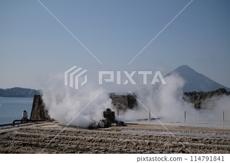Smoke rising from the ruins of the Yamakawa Salt Factory 114791841