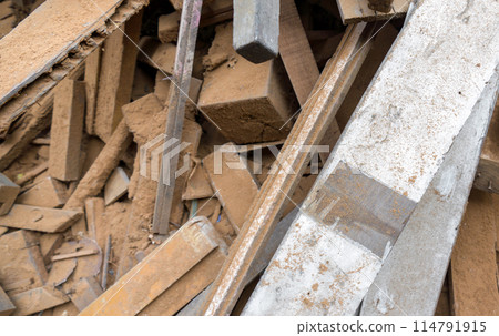 White wooden board lay on the leftover wooden pieces. Stacked together in a pile. Top view 114791915