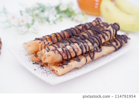 delicious chocolate flavored banana rolls delicious chocolate flavored banana rolls 114791954