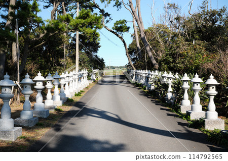 A road lined with stone lanterns A road lined with stone lanterns 114792565