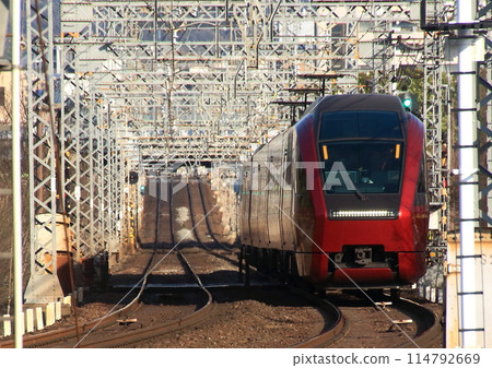 Hitotori limited express train on the Kintetsu Nara Line running through the World Heritage Heijo Palace ruins 114792669