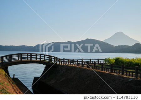 Spring at Lake Ikeda with the silhouette of Mt. Kaimon in view Spring at Lake Ikeda with the silhouette of Mt. Kaimon in view 114793110