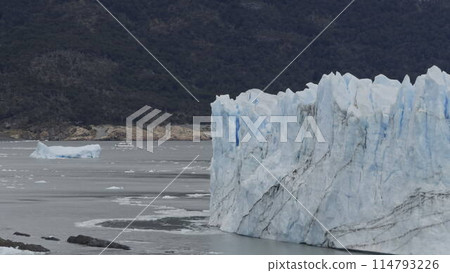 Perito Moreno Glacier s Walls with Approaching Tourist Boat 114793226
