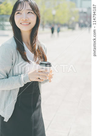 A working woman taking out hot coffee 114794187