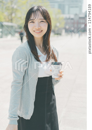 A working woman taking out hot coffee 114794189