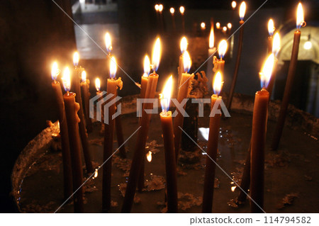 Candles in the Basilica of Nativity in Bethlehem, Israel 114794582
