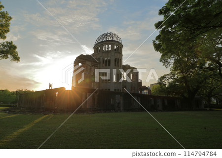 View of the Hiroshima Atomic Bomb Dome illuminated by the setting sun 114794784
