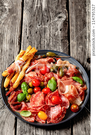 italian antipasto plate of cured meat and veggies italian antipasto plate of cured meat and veggies 114795327