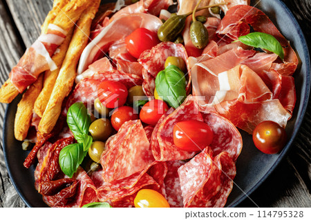 italian antipasto plate of cured meat and veggies italian antipasto plate of cured meat and veggies 114795328