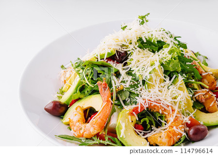 Fresh seafood salad with avocado and arugula 114796614