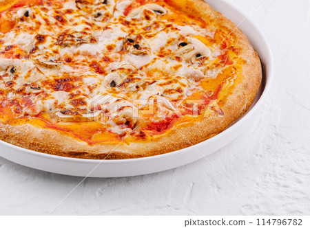 Freshly baked cheese pizza on white plate 114796782