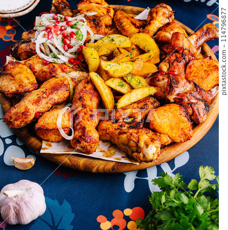 Traditional spicy roasted chicken and potatoes feast 114796877