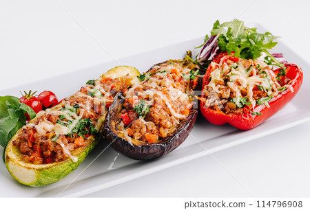 Stuffed bell peppers on a white plate 114796908