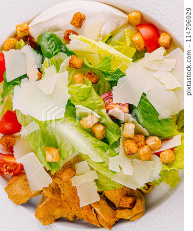 Fresh caesar salad on white plate 114796929