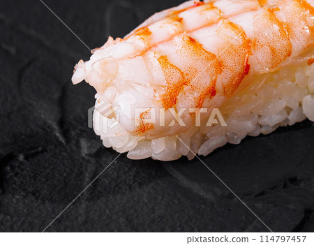 Fresh shrimp sushi on dark slate background 114797457
