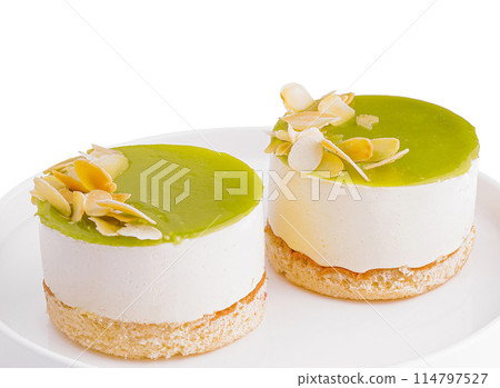 Mini lime cheesecakes on white plate 114797527