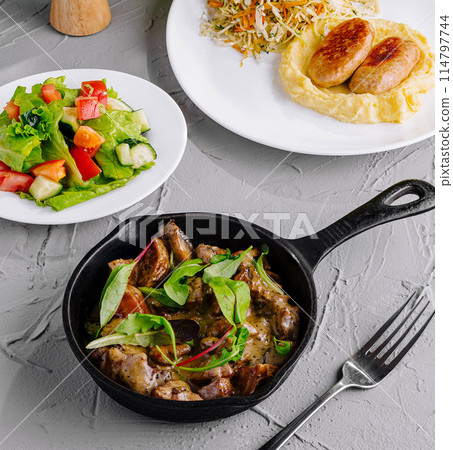 Gourmet healthy meal assortment on elegant table setting 114797744