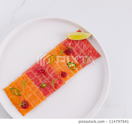 Fresh salmon carpaccio with citrus and chili Fresh salmon carpaccio with citrus and chili 114797841