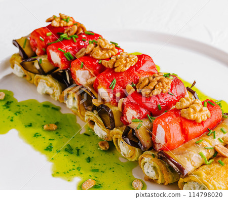 Gourmet stuffed chicken roll with vegetables and nuts 114798020