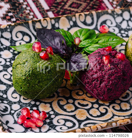 Colorful two of gourmet vegan balls on decorative plate Colorful two of gourmet vegan balls on decorative plate 114798026