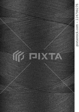 Texture of black color threads in spool close up, macro Texture of black color threads in spool close up, macro 114798276