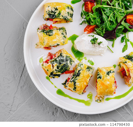 Fresh spinach and cheese stuffed omelette with salad Fresh spinach and cheese stuffed omelette with salad 114798430