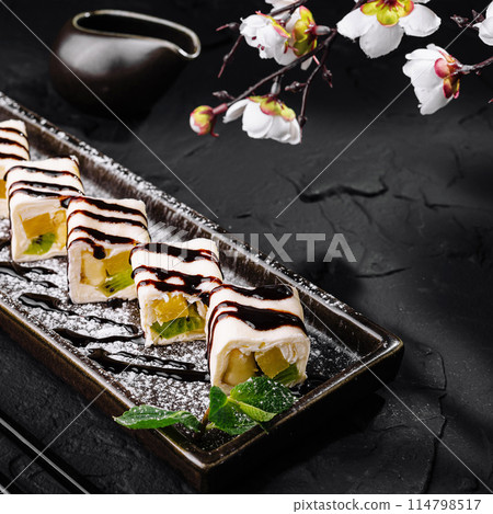 Exquisite sushi dessert plate with chocolate sauce Exquisite sushi dessert plate with chocolate sauce 114798517