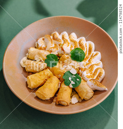 Gourmet stuffed pancakes on artistic plate 114798524