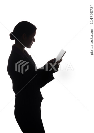 Young woman in suit shows pointer forward, side view - silhouette Young woman in suit shows pointer forward, side view - silhouette 114798724