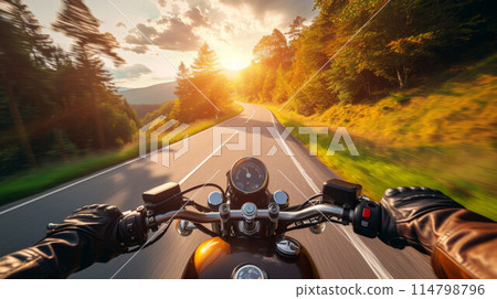 Biker driving a motorcycle rides along the asphalt road. First-person view Biker driving a motorcycle rides along the asphalt road. First-person view 114798796
