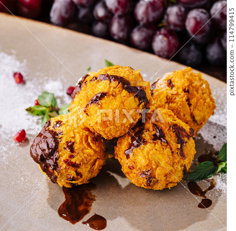 Gourmet fried ice cream scoops on elegant plate Gourmet fried ice cream scoops on elegant plate 114799415