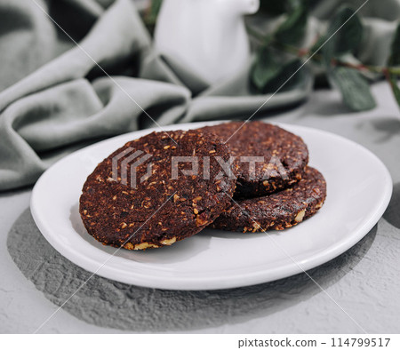 Homemade chocolate cookies on white plate Homemade chocolate cookies on white plate 114799517