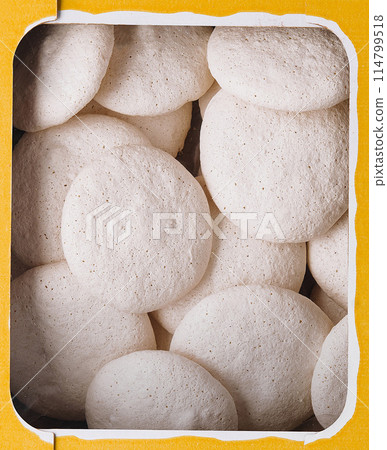 Box of vanilla meringue cookies close up background 114799518