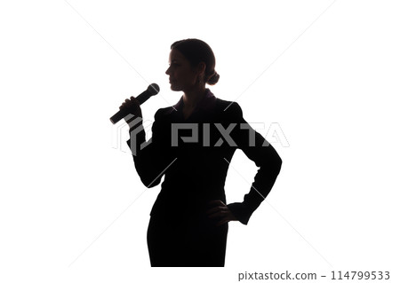 Young woman singing into the microphone Young woman singing into the microphone 114799533