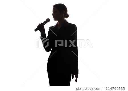Young woman singing into the microphone Young woman singing into the microphone 114799535