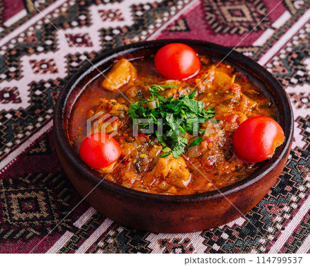 Traditional clay pot stew with fresh herbs Traditional clay pot stew with fresh herbs 114799537