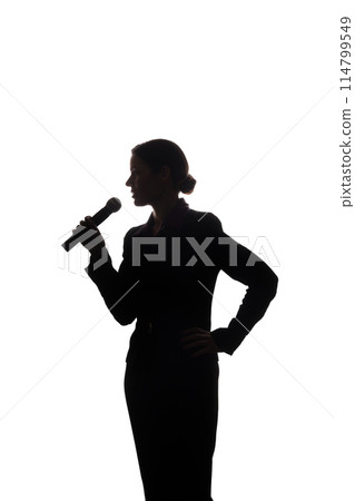 Young woman singing into the microphone Young woman singing into the microphone 114799549