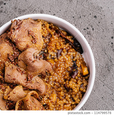 Hearty lentil stew with sliced meat Hearty lentil stew with sliced meat 114799578