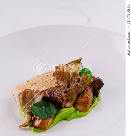 Gourmet seared fish fillet on pea puree Gourmet seared fish fillet on pea puree 114799619