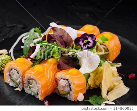 Exquisite salmon sushi platter with edible flowers 114800035