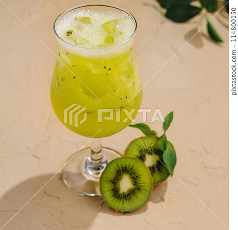 Fresh kiwi cocktail on a sunny table Fresh kiwi cocktail on a sunny table 114800150