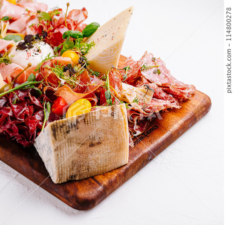 Gourmet charcuterie board with artisanal cheeses and meats Gourmet charcuterie board with artisanal cheeses and meats 114800278