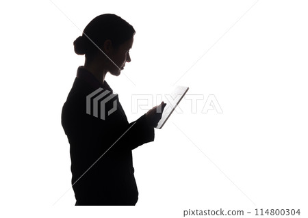 Young woman in suit shows pointer forward, side view - silhouette Young woman in suit shows pointer forward, side view - silhouette 114800304