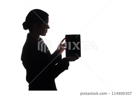 Young woman in suit shows pointer forward, side view - silhouette Young woman in suit shows pointer forward, side view - silhouette 114800307