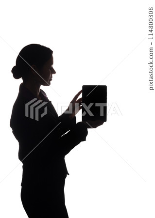 Young woman in suit shows pointer forward, side view - silhouette Young woman in suit shows pointer forward, side view - silhouette 114800308