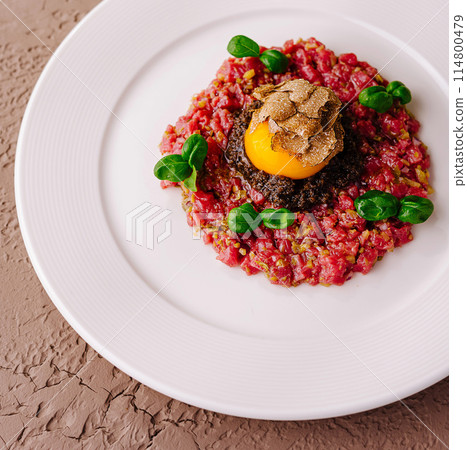 Gourmet tartare with quail egg and truffle Gourmet tartare with quail egg and truffle 114800479
